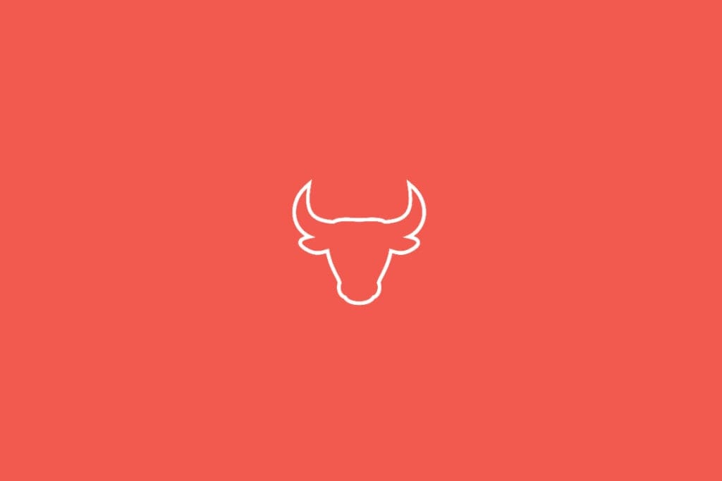 Ilustração do signo de Touro em fundo vermelho, com a cabeça de um touro de chifres curvados