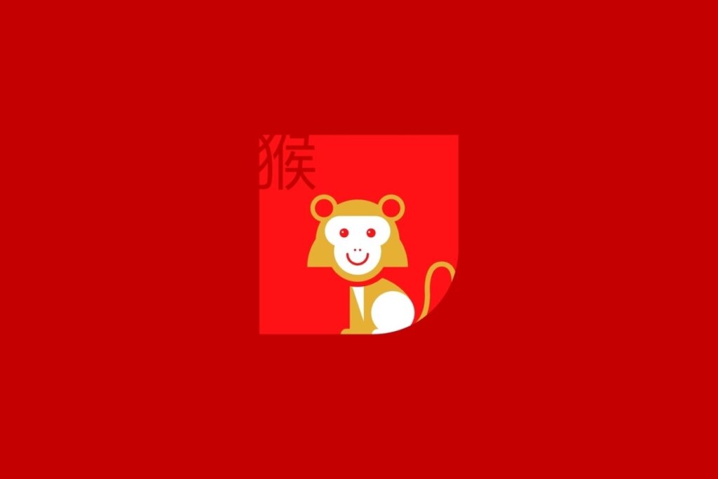 Ilustração do signo de Macaco, contendo um macaco dourado sorridente com rosto branco, em fundo vermelho
