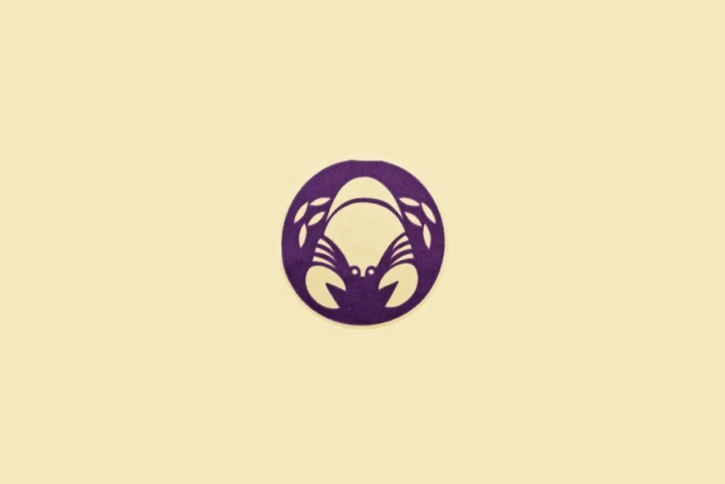 Ilustração minimalista do signo de Câncer, com um caranguejo sobre fundo bege