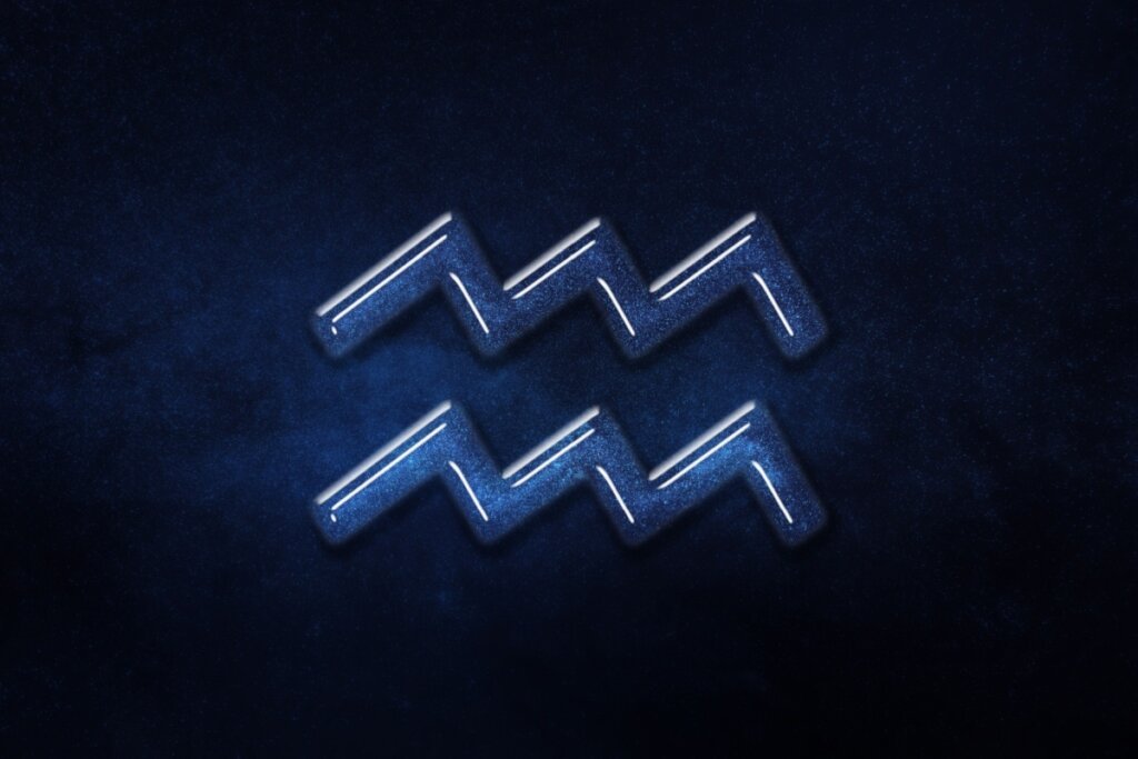 Símbolo do signo de Aquário, retratando duas ondas em ziguezague com uma aparência vítrea azul e textura de galáxia estrelada em seu interior, sobre um fundo de céu noturno azul-escuro profundo e estrelado.
