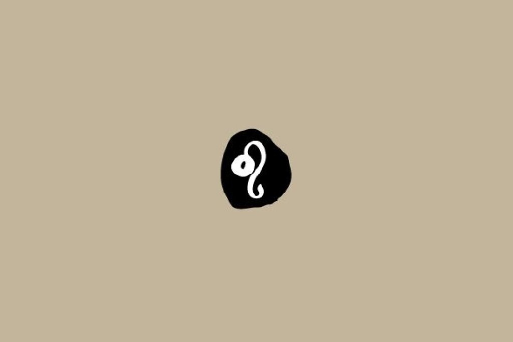Símbolo do signo de Leão em branco dentro de um círculo preto sobre um fundo bege