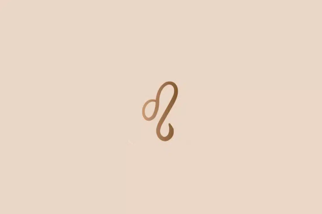 Ilustração do signo de leão na cor marrom em um fundo bege-claro