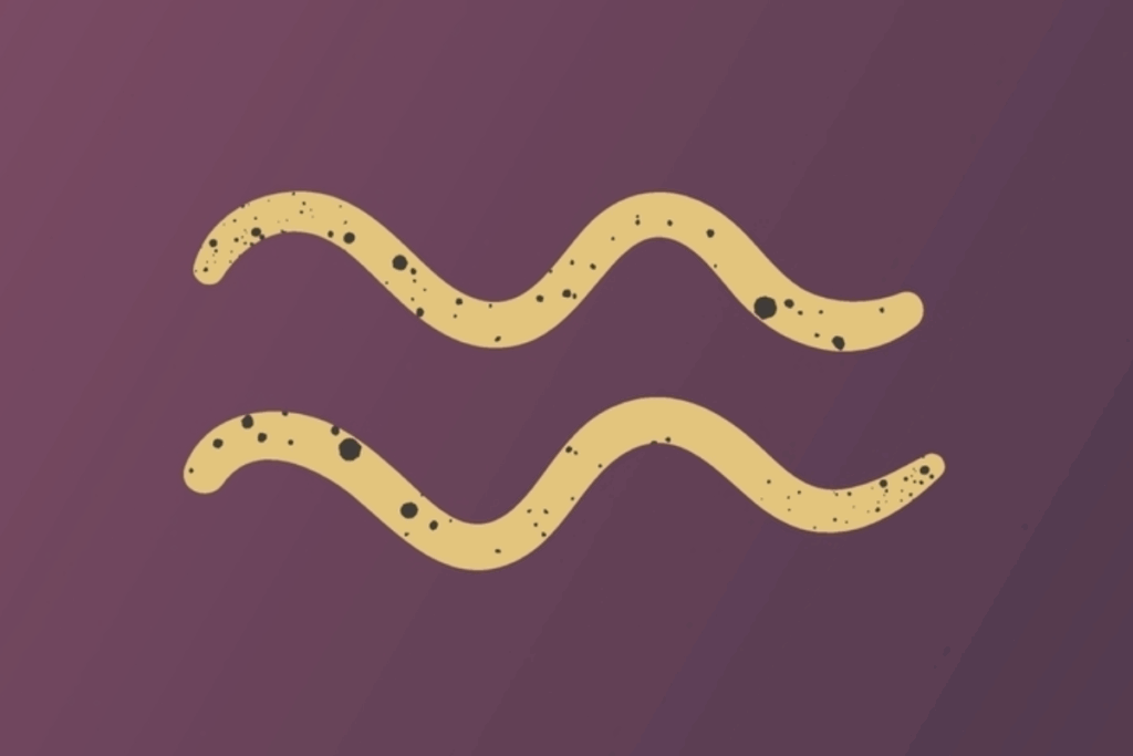 A imagem apresenta o símbolo do signo de aquário em tom dourado, centralizado sobre um fundo roxo escuro. O símbolo possui pequenos detalhes e manchas escuras que criam um efeito texturizado e artístico.