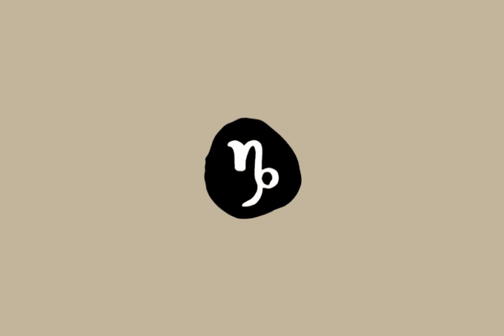 Símbolo do signo de Capricórnio em branco dentro de círculo preto em fundo bege